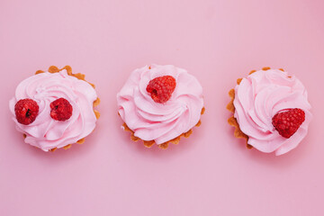 cupcakes with pink icing and sprinkles