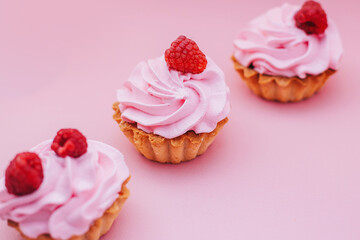 cupcake with pink icing and sprinkles