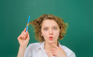 Obraz premium Surprised teacher. School subjects. Back to school. Portrait of female teacher with pencils. Pen. Pencils. Education. School. Job. Teacher in classroom.