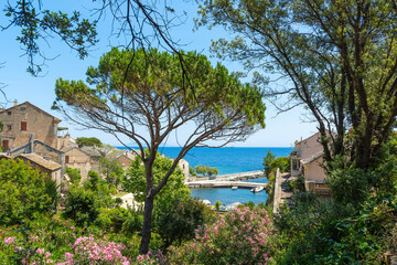 Fototapeta na wymiar Porticciolo village in front of the sea in Corsica