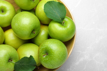 Ripe juicy green apples on white table, top view