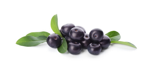Pile of fresh acai berries with leaves isolated on white
