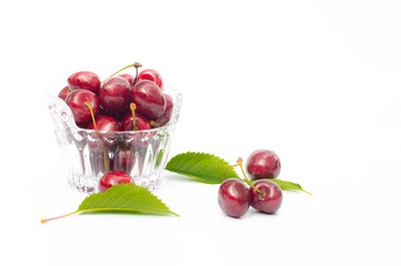 Fresh cherry in a tall glass isolated on white background. fresh ripe cherries. sweet cherries.