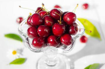 Fresh cherry in a tall glass isolated on white background. fresh ripe cherries. sweet cherries.