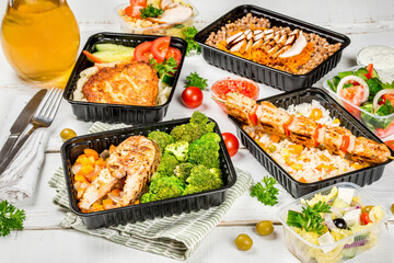 Several dishes in plastic containers shot from above