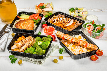 Several dishes in plastic containers shot from above