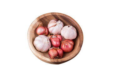 Garlic and red onions in a wooden bowl on white background