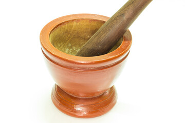 Wooden mortar with pestle on white background