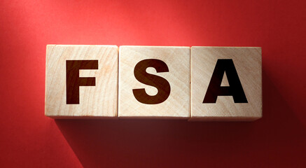 FSA abbreviation on red background. Flexible Spending Account financial concept