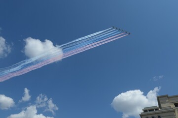 A group of su-25 Grach attack aircraft smoke the colors of the Russian flag in the sky over Moscow during a parade dedicated to the 75th anniversary of victory In the great Patriotic war