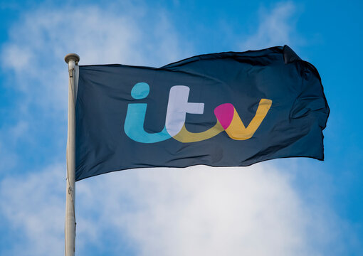 London, England - January 19, 2018:  A Flag bearing the ITV logo flies above ITV Plc Television Studios in London, ITV first launched in 1955.