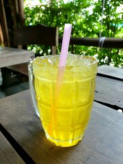 glass of lemonade.picture of yellow of chrysamthemum ice tea.