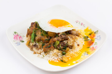 Rice topped with stir-fried pork and basil with fried egg