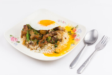 Rice topped with stir-fried pork and basil with fried egg