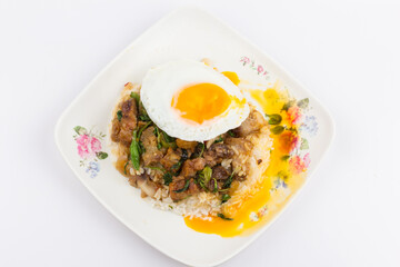 Rice topped with stir-fried pork and basil with fried egg