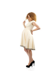 Cute caucasian adult pregnat woman in white dress isolated on white background