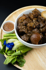 Braised pork belly in a bowl, a famous Thai food called Pa-Lo Thai Braised Pork Belly.