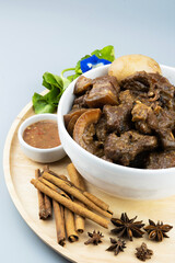 Braised pork belly in a bowl, a famous Thai food called Pa-Lo Thai Braised Pork Belly.