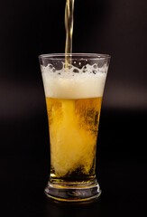 Beer being lined up in a clear glass