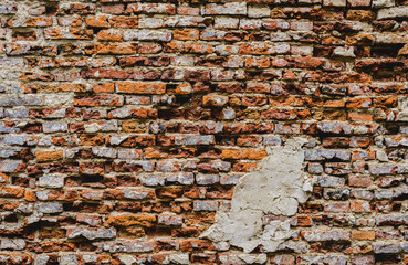 old ruins brick wall with concrete cracked