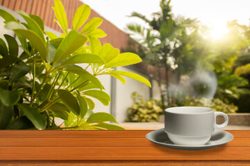 A cup and tea on the table above the sunny mountain landscape nature background