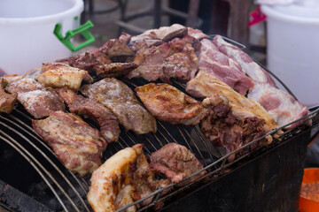Grilled pork on the grill selected focus