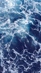 Background of the sea surface, foam stains on clean fresh ocean water. Vertical photo aerial view