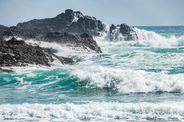 Ocean waves crashing on rocks. Whangarei, New Zealand