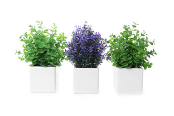 Fototapeta premium Beautiful artificial plants in flower pots isolated on white