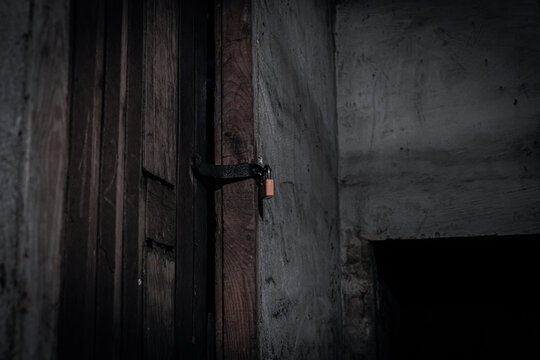 A Padlock In The Door In The Old Dark Basement