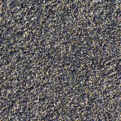 Multi-colored pebbles on a waterproofing canvas