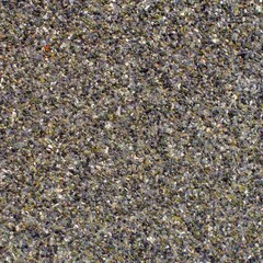 Multi-colored pebbles on a waterproofing canvas