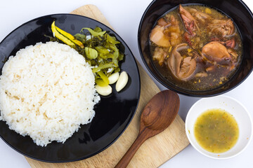 Stewed pork leg with pickled mustard greens and rice on white background