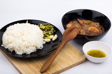 Stewed pork leg with pickled mustard greens and rice on white background
