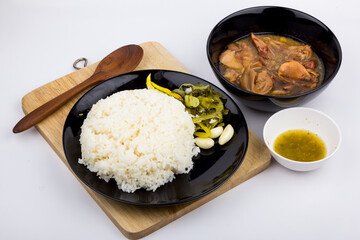 Stewed pork leg with pickled mustard greens and rice on white background