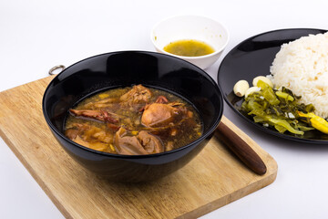 Stewed pork leg with pickled mustard greens and rice on white background