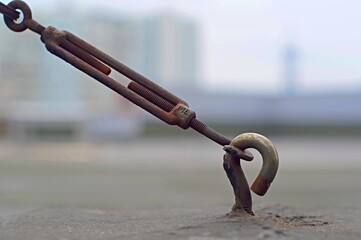 Rusty steel hook with tie