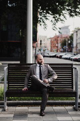 Businessman sitting on bench