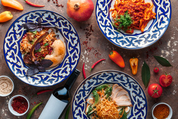 The oriental cuisine. Restaurant uzbek pilaf or lamb pilaf, lagman, salad with beef. National middle asian dish.