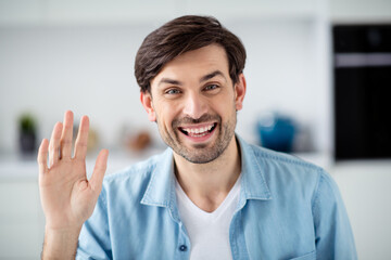 Closeup photo of young cheerful guy internet online meeting video call lesson friendly teacher conference study say hi students good mood webcam social distance quarantine indoors © deagreez