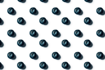 Pattern of freshly juicy picked blueberries isolated on white background. 
