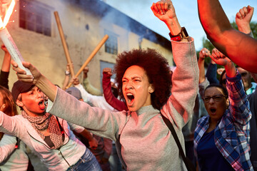 Fototapeta premium Furious crowd of people participating on public demonstrations.