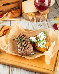 New york beef steak baked potatoes  sour cream 