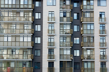 Fototapeta na wymiar gray building facade with balconies