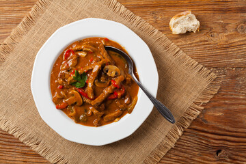 Boeuf, Stroganow, Strogonow. Classic, Russian beef stew. Served on a white plate. Top view. Natural background.