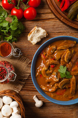Boeuf, Stroganow, Strogonow. Classic, Russian beef stew. Served in a blue bowl. Top view. Natural background.