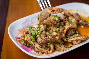 Thai food name is Grilled pork with spicy salad, Thai food