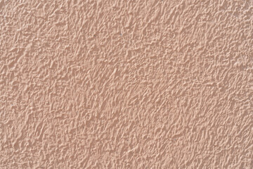 Pink stucco texture. Designer interior background. Abstract architectural surface.
