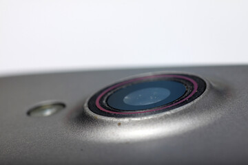 Fototapeta premium Macro shot of a smartphone camera on a white isolated background