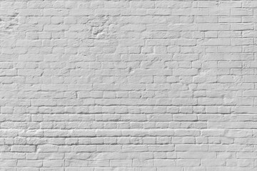 White brick wall. Loft interior design. White paint of the facade.